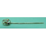 A 15ct gold stick pin set with a sapphire and a diamond