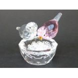 Swarovski style bird bath featuring one pink and one clear bird on a cut glass bowl filled with