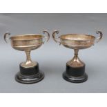 Two similar hallmarked silver trophy cups, one for Ludlow Castle Tennis Club,