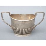 A George VI hallmarked silver two-handled sugar bowl with reeded decoration, B'ham 1939,