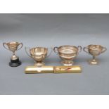 Four various mid 20thC hallmarked silver twin handled trophy cups including Ludlow Golf Club,