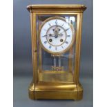 A four glass late 19thC brass mantel clock, the two-train movement by F.