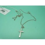 An 18ct white gold cross on 9ct white gold chain (7.