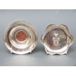 A hallmarked silver coin-based bowl and a white metal bowl marked 925,