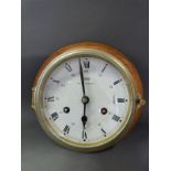 A Schatz brass Royal Mariner ship's bulkhead clock, the two train 8 day movement striking on a bell,