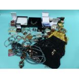A quantity of costume jewellery, tiger's eye pendant,