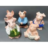 A set of five Nat West pigs