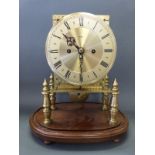 A brass skeleton clock with two train double fusee movement, striking on a bell,