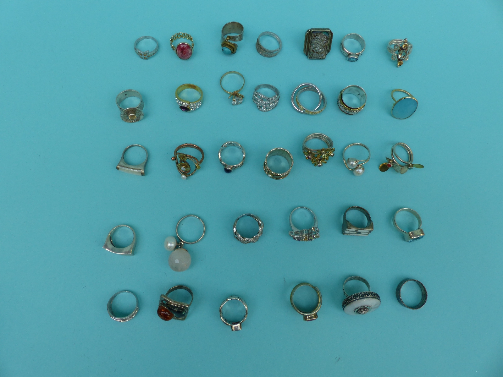 A collection of 33 silver/white metal dress rings including ruby, pearl, - Image 2 of 2