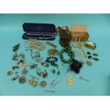 A collection of costume jewellery to include mother of pearl buckles, brooches,