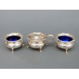 A pair of George V hallmarked silver open salts with blue glass liners, Sheffield 1934,