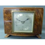 A c1930 Elliot clock in walnut case of rectangular design the Arabic dial with blued steel hands,