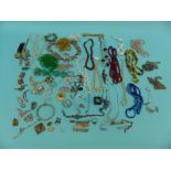 A collection of costume jewellery to include glass beads, silver brooch, beaded necklaces, paste,