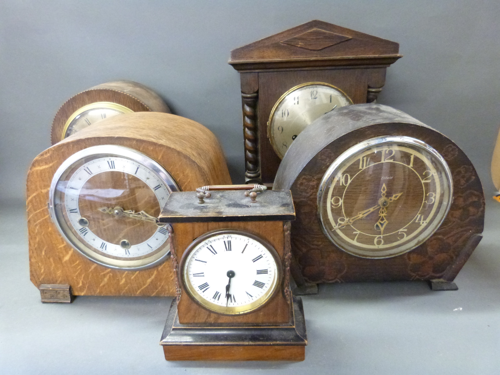 Five various c1930s mantel clocks of various designs, includes Enfield, German example, single,