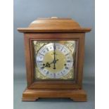 A German c1970 mahogany cased mantel clock, the movement by Kleninger,