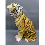 A ceramic fireside tiger cub,