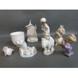 A collection of boxed Lladro figures including squirrel, Japanese monkey with slip cover,