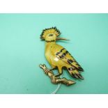 A silver gilt brooch in the form of a Hoopoe set with guilloche enamel