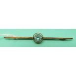 A 9ct gold brooch set with a round cut aquamarine