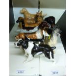 Ten Beswick and Royal Doulton dogs including large spaniel, collies,