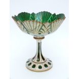 Overlaid and cut glass tazza with white casing over green ground highlighted and ornately decorated