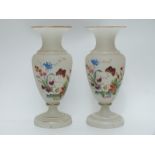 A pair of hand painted pedestal glass vases decorated with butterflies and flowers on opaque ground,