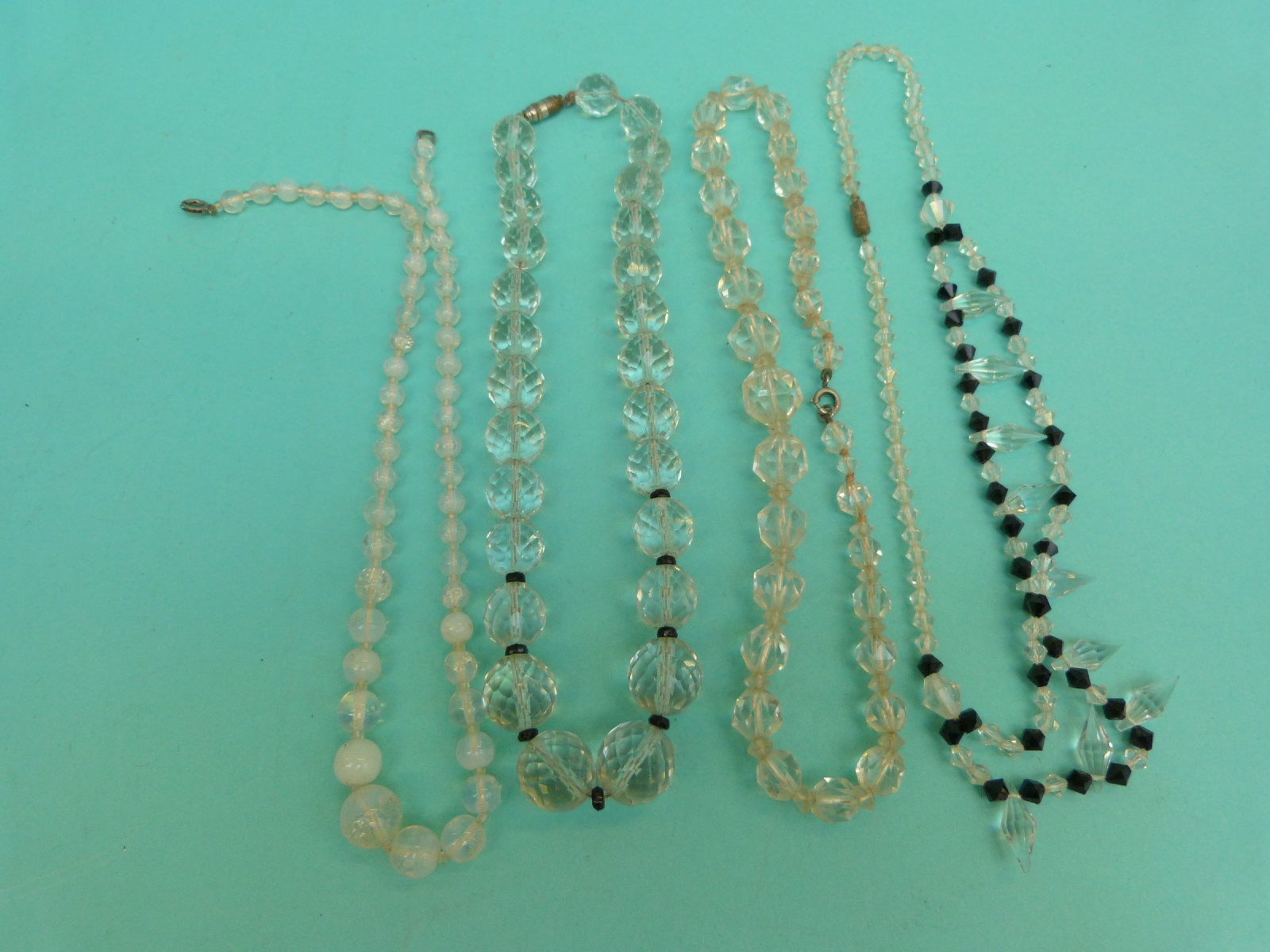 A collection of beaded necklaces to include glass beads,