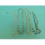 A collection of beaded necklaces to include glass beads,