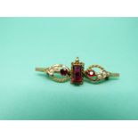 A 15ct gold brooch set with garnets and seed pearls (Chester 1906)