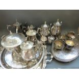 A large quantity of silver plate to include teasets, punch or similar bowl, cutlery,