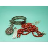 A Victorian silver bangle, coral necklace,