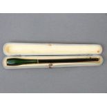 A flash overlaid cut glass cheroot holder with black stain over green ground and yellow metal
