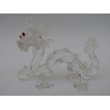 Swarovski cut glass Chinese dragon with a ball decorated with red eyes,