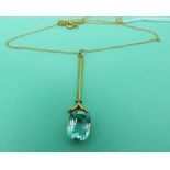 A 9ct gold pendant and chain set with a blue stone possibly topaz.
