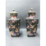 A pair of English porcelain famille noir covered vases, 33cm tall.