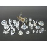 Twenty-one Swarovski cut glass animals and paperweights including fish, elephant, birds, swans, fox,