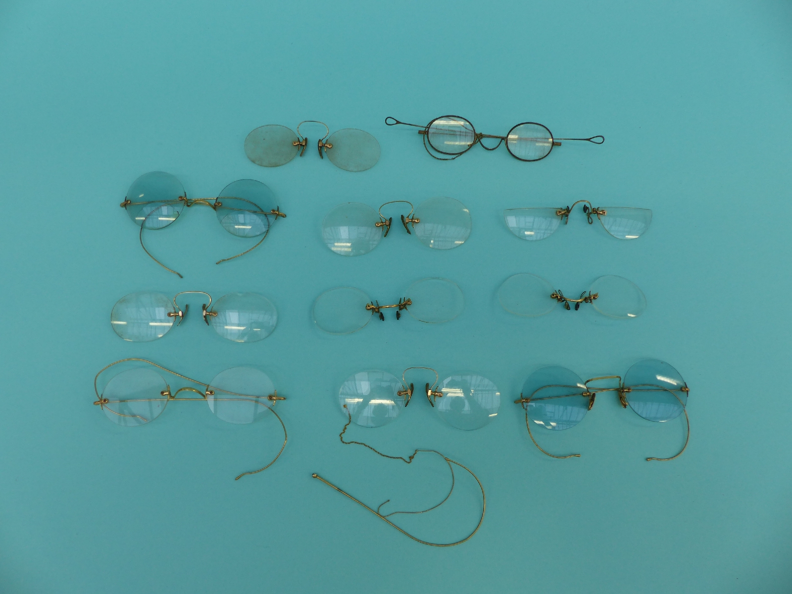 A collection of early spectacles/glasses including coloured lenses, gold plated, Georgian,