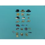 A collection of brooches in the form of hats and shoes including plastic and gem set
