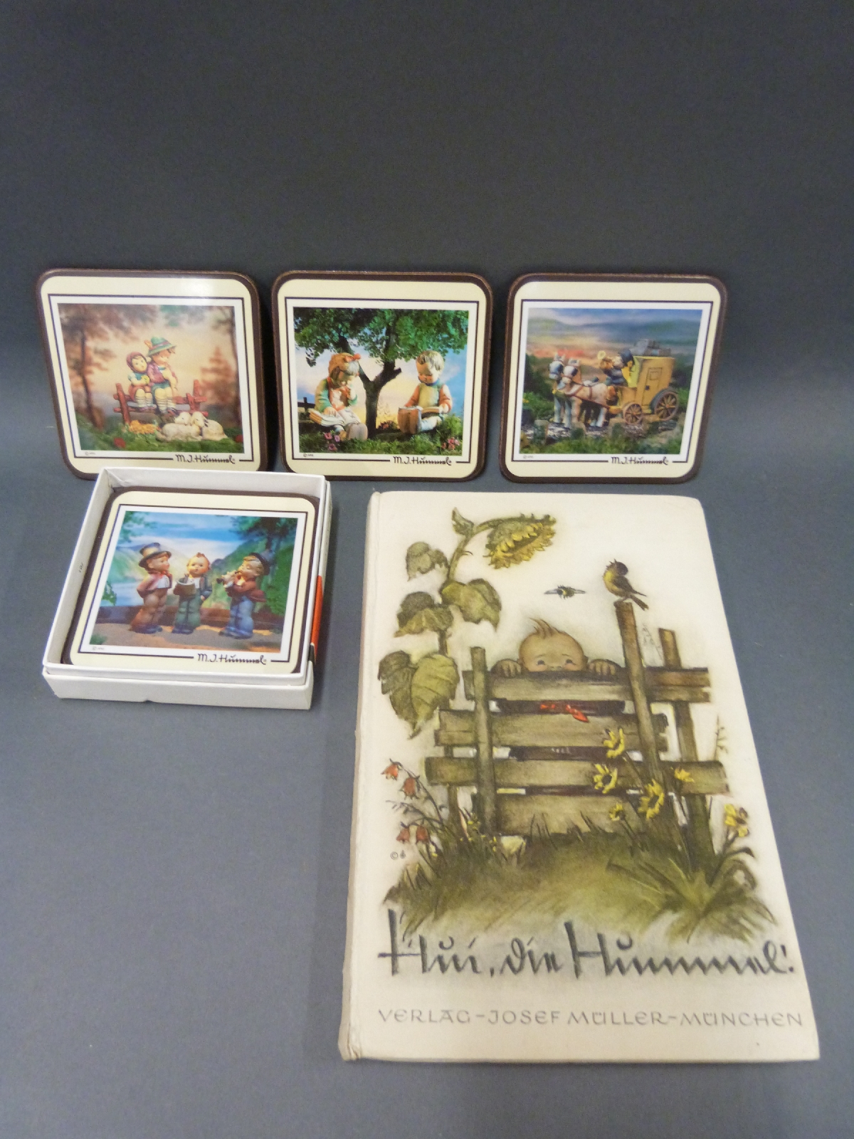 Four Goebel Hummel figures including boy reading newspaper, Mickey Mouse and unusual rabbits, - Image 3 of 3