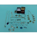 A collection of silver jewellery to include 21 silver rings, silver bangle,