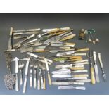 A large collection of silver plated cutlery mostly with mother of pearl and ivory handles