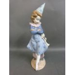 A Lladro figure of a clown with trumpet