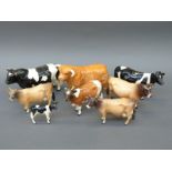 Eight Beswick cattle including Friesian family, Jersey,