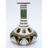 Overlaid glass vase with white casing over green ground highlighter in gilt,