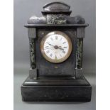 A late 19thC black slate mantel clock with green marbled decoration & enamel Roman dial,