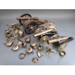 A quantity of brass items to include miniature tea pots, irons, telephones etc,