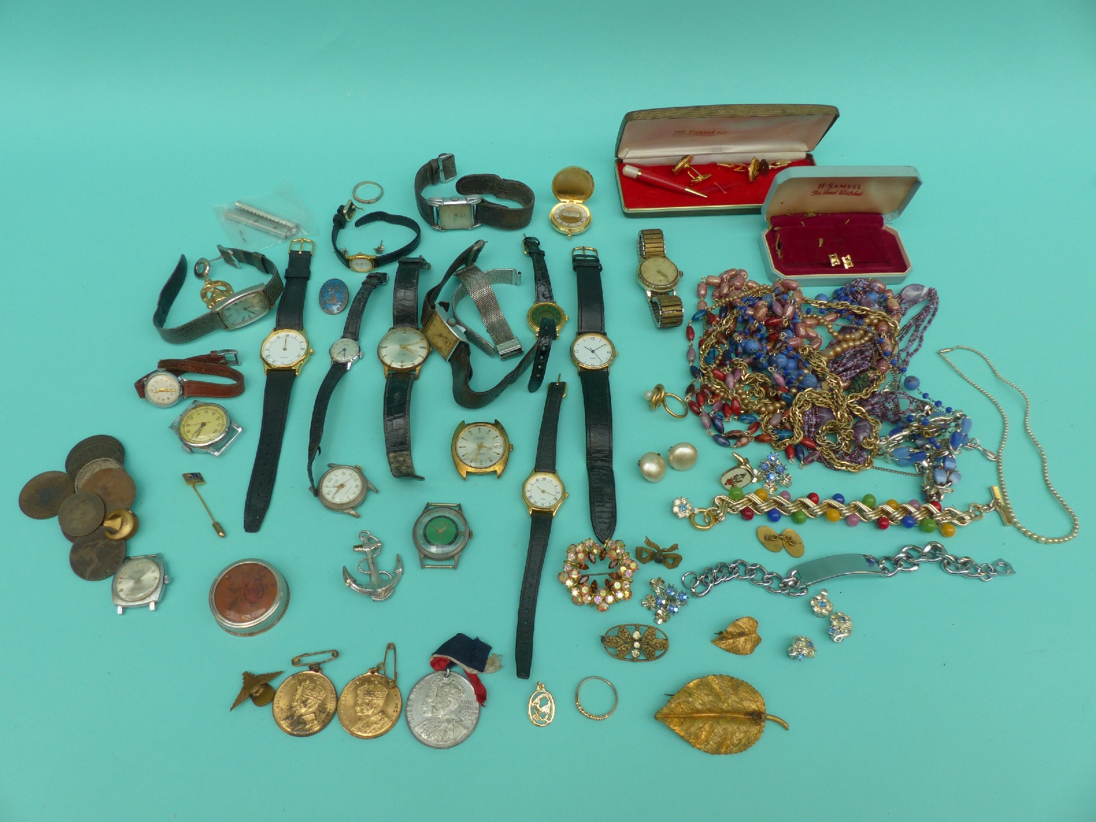 A collection of costume jewellery and watches