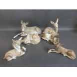 A collection of Lladro animal figures including donkeys, fox, deer,