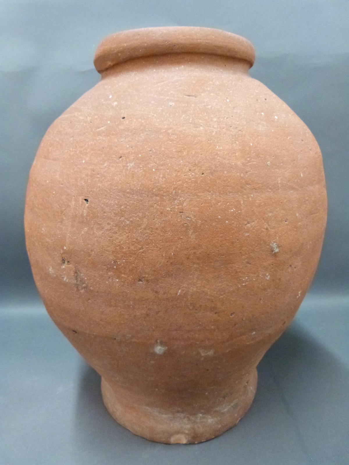 A large antique terracotta jar, 18th/19thC possibly much earlier,