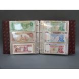 One hundred world bank notes in collectors' album to include Reichsbanknotes, Argentina, Zambia,